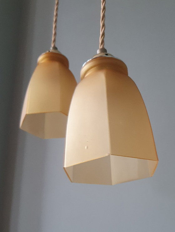 Image 1 of Set Vintage franse gele hanglampen van gekleurd glas.
