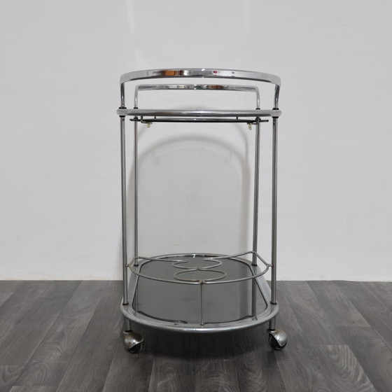 Image 1 of Stalen voedseltrolley met dubbele plank en gerookt glas, ontwerp uit de jaren 70