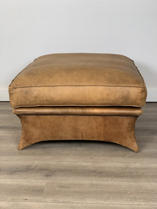 Stoer lederen hocker