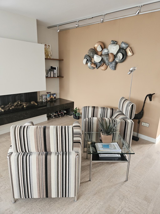 2 sillones Leolux con reposapiés