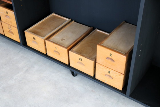 Image 1 of armoire scolaire vintage en bois avec bacs de rangement