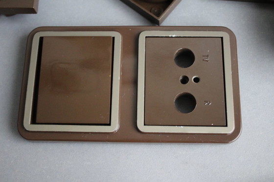 Image 1 of Large collection of vintage brown light and socket switches from the 1970s, brand BLASS.
