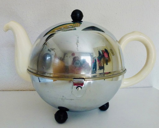 Keramiek Theepot met thermisch Chroom omhulsel wat de inhoud warm (of koud) houdt.