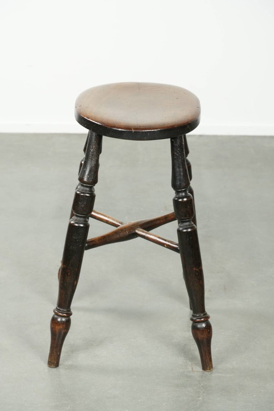 Image 1 of Antique English Windsor stool from the early 19th century with a unique oval shape