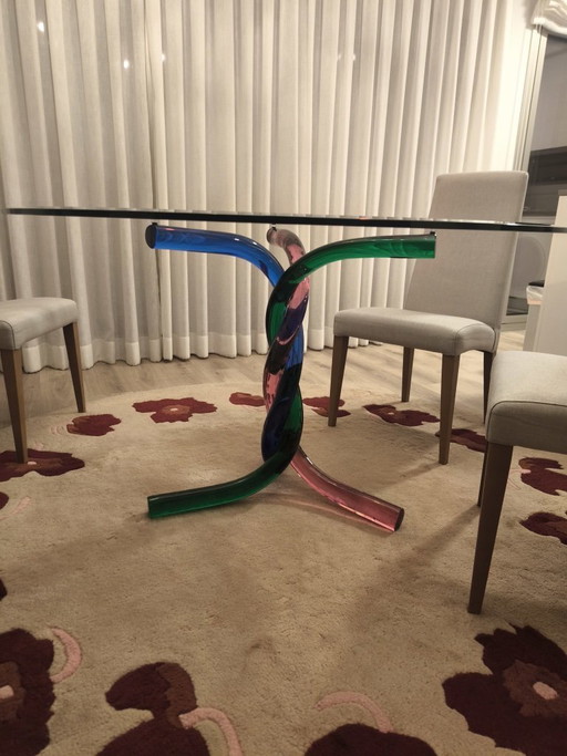 Glass dining table with artistic Murano glass base