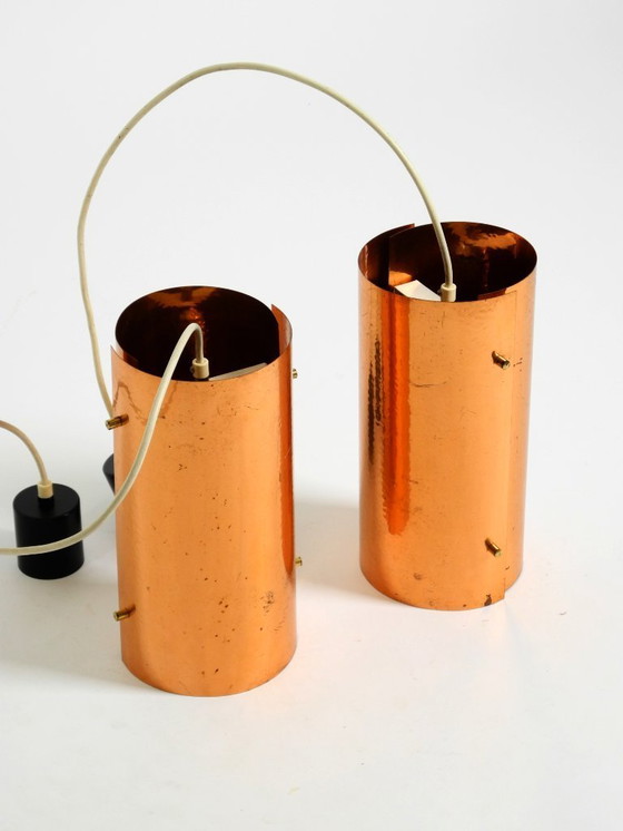 Image 1 of Two rare mid-century tube pendant lamps consisting of two screwed-together copper bowls