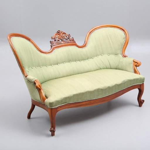 Neo-Rococo antique sofa in wood with textile upholstery, dating to 1920–1930, measuring 164 cm wide by 70 cm high and 94 cm deep