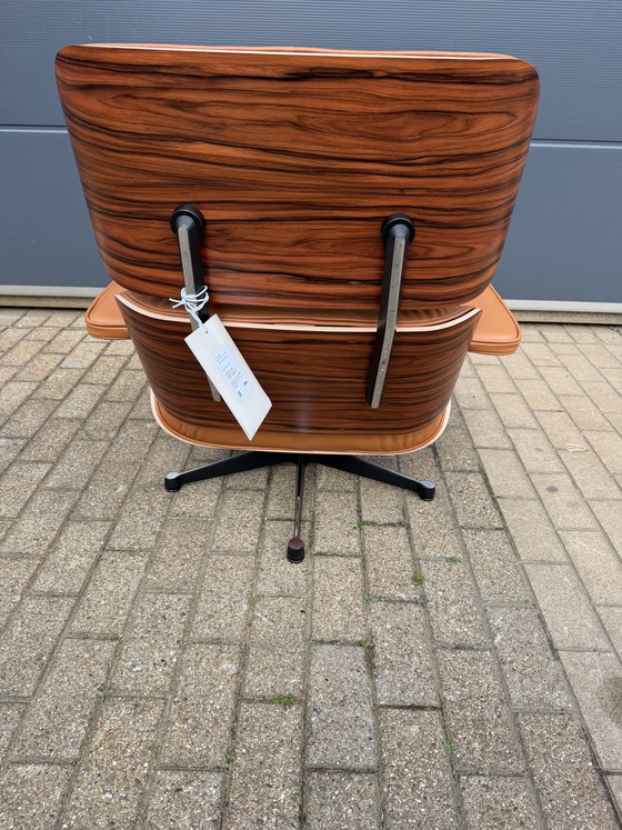 Image 1 of Poltrona lounge Vitra Eames XL + poggiapiedi, in pregiata pelle nera e palissandro Santos. NUOVA!!