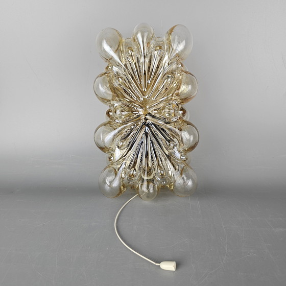 Image 1 of Vintage glass bubble wall lamp by Glashutte Limburg. Design by Helena Tynell. Glass and brass. 1960, Germany.