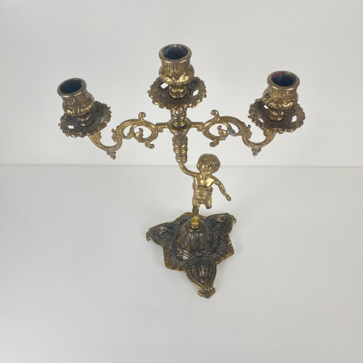 Antique three-arm candelabra in cast brass, cherub, late 19th-early 20th century