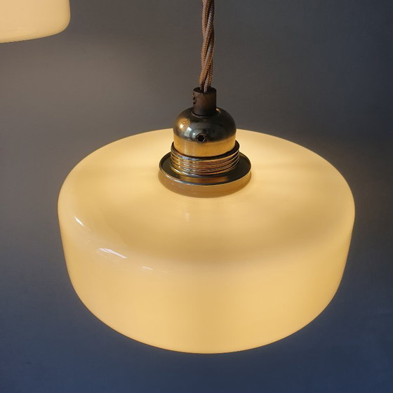 Image 1 of Vintage pendant lamp set (2) of yellow pastel opaline glass. Art Deco design.