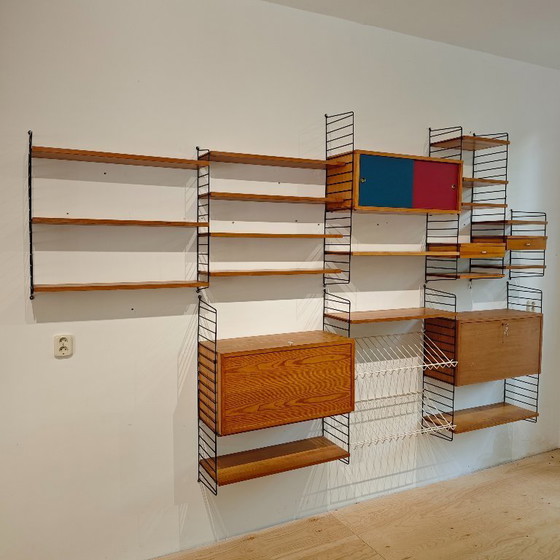 Vintage String wall system cabinet Nils Strinning | €1,550 | Whoppah