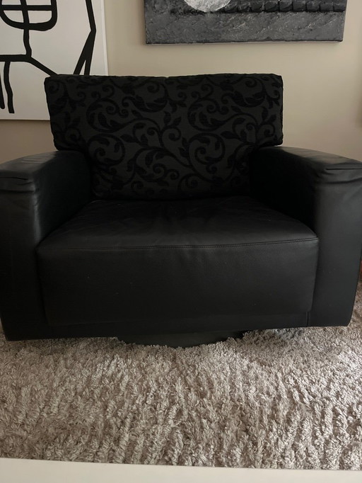 Poltrona girevole in morbida pelle Montis