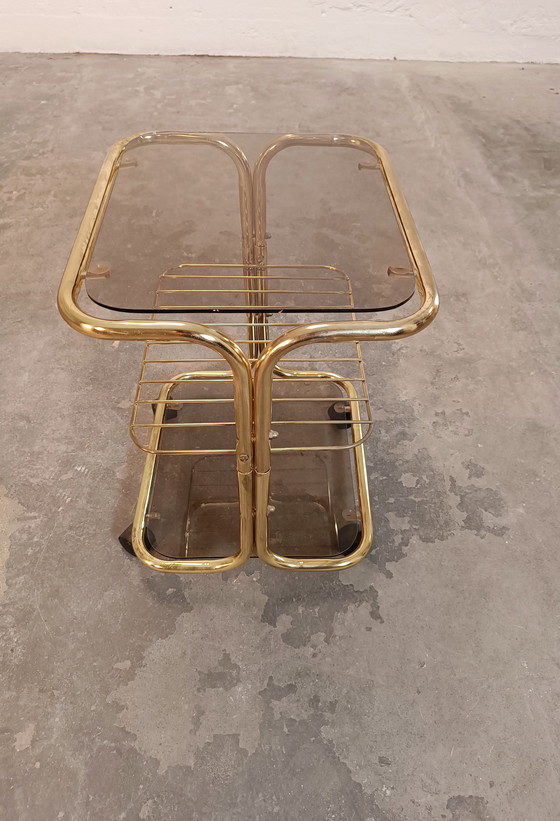 Image 1 of Vintage gold coloured and glass trolley side table 