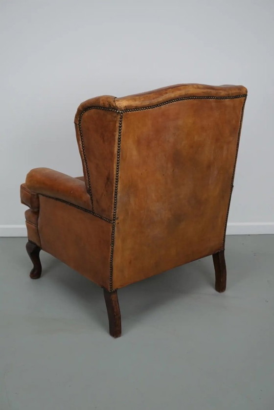 Image 1 of Vintage Nederlandse cognackleurige leren clubfauteuil met voetenbank