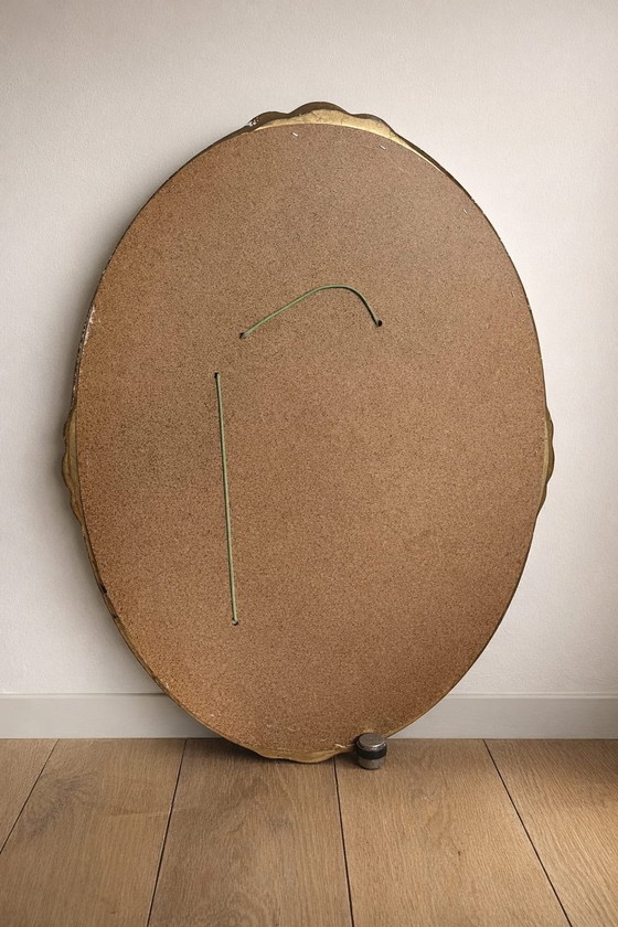 Image 1 of Ovale barokspiegel met zilverkleurige lijst/gouden bloemen