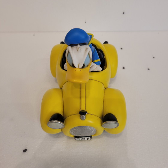 Image 1 of Donald Duck avec voiture jaune, Rutten, résine, années 2000 - États-Unis