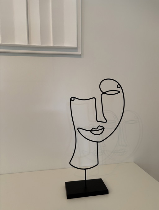 Modern wire sculpture in black steel