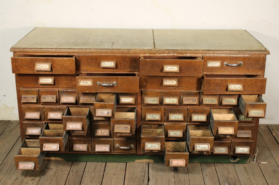 Image 1 of Antique industrial apothecary cabinet • Vintage wood and metal drawer cabinet with many compartments