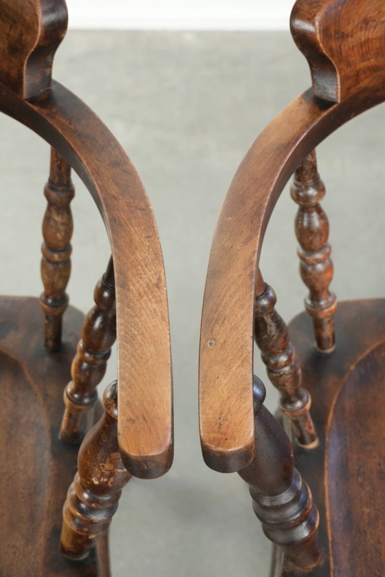 Image 1 of 2x antique English wooden pub/captain chairs from the late 19th century with character and a beautiful color scheme