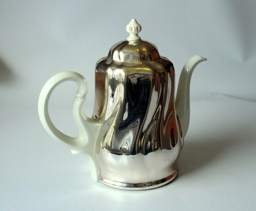 Caffettiera HKE in porcellana di alta qualità con coperchio scaldavivande in metallo argentato.