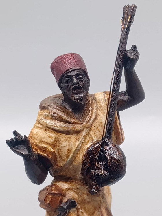 Image 1 of Ecole Orientaliste du XXème siècle, Musicien de rue en métal belle patine