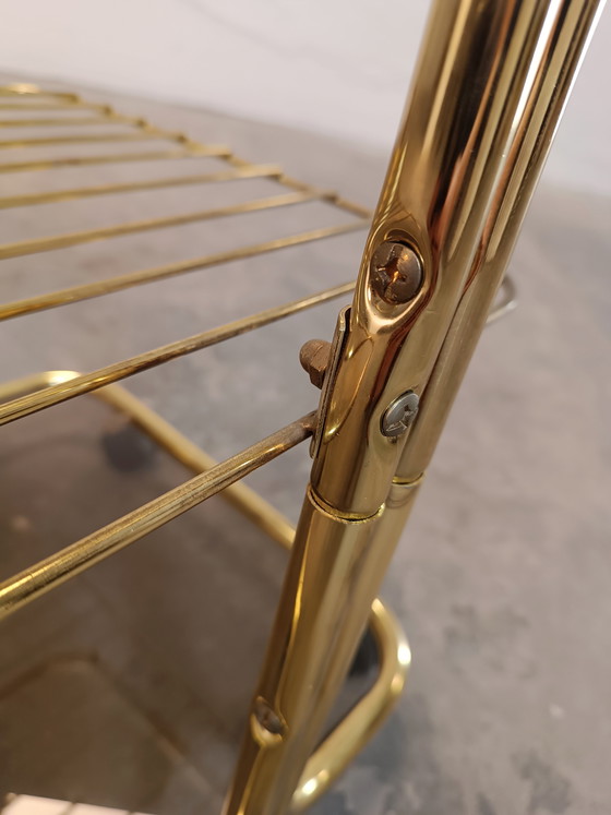 Image 1 of Vintage gold coloured and glass trolley side table 
