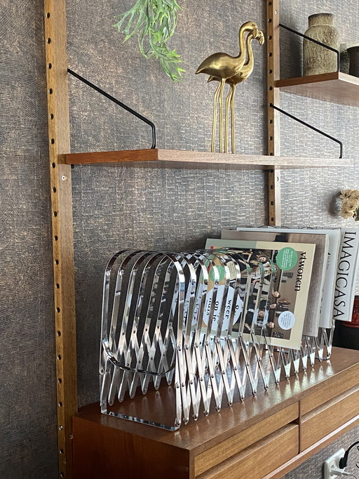 Harmonica chrome magazine rack Luther Evans Radius Design