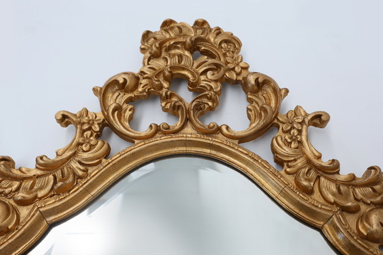 Image 1 of French Rococo or Baroque style facet-cut crest mirror in gilded carved wood