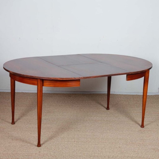 Round, extendable wooden dining table, 1960