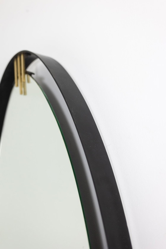Image 1 of Lacquered and patinated brass mirror, ovoid shape. Circa 1950/60.