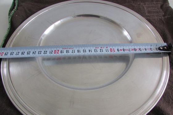 Image 1 of Un plato base plateado de la marca francesa Christofle.