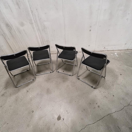 Image 1 of Set van 4 opklapbare stoelen in chroom- en leerstijl uit het midden van de 20e eeuw, Italië, jaren 70.