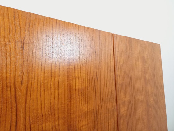 Image 1 of Vintage kledingkast in modernistische stijl van teakhout en metaal uit de jaren 60.