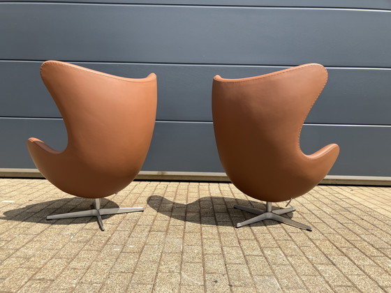 Image 1 of 2x Fritz Hansen Egg Chair + Ottoman en cuir Cognac NEUF !!!