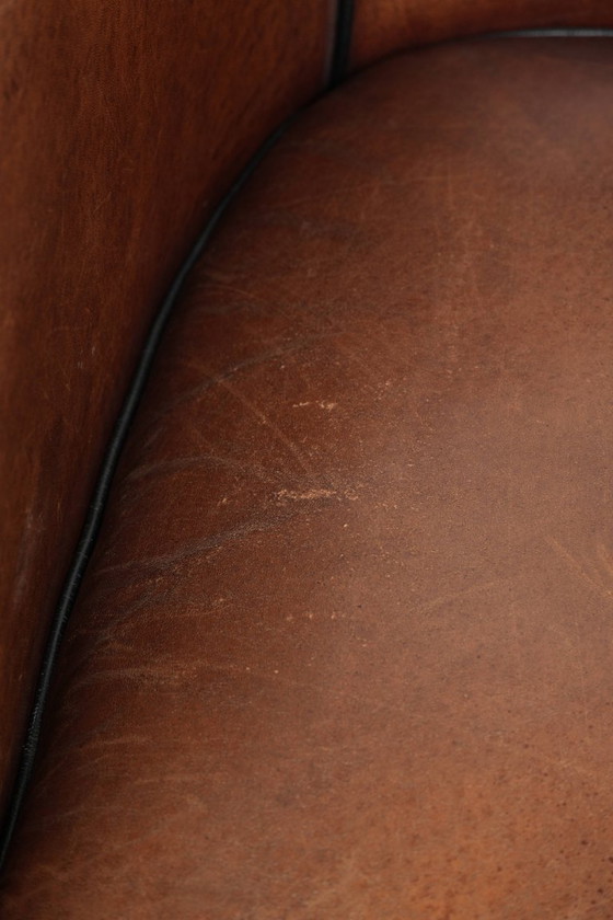 Image 1 of 2x schapenleren Art Deco design clubfauteuil met een mooi patina, zwarte biezen en mooie kleuren