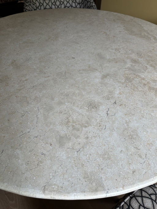 Round travertine dining table