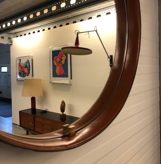 Image 1 of https://www.1stdibs.com/furniture/mirrors/wall-mirrors/pizzetti-cognac-leather-mirror-1950s-italy/id-f_33697732/