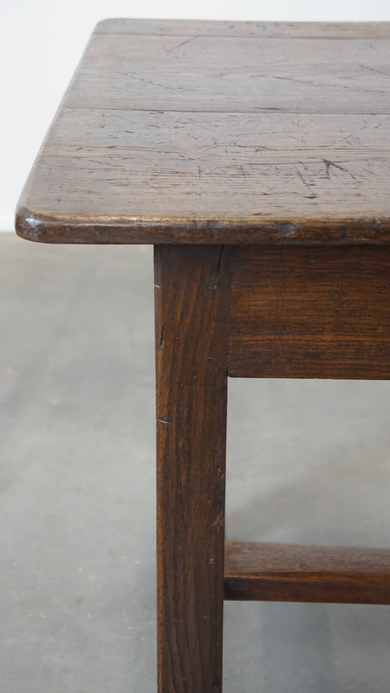 Image 1 of Antique early 19th century French dining table made of oak with 1 drawer