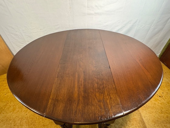 Image 1 of Jacobean Revival massief eiken klaptafel met neerklapbaar blad (circa 1900)