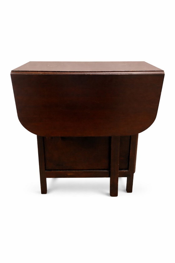 Image 1 of Tavolo pieghevole vintage con ante a ribalta – Legno scuro, circa 1950