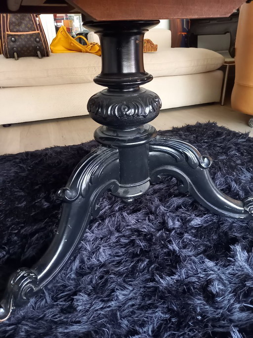 Antique round table on wheels