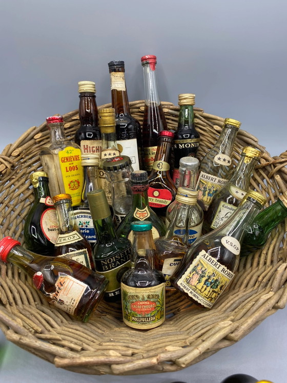 32 vintage miniature spirit bottles and large wicker basket – Decorative Objects, Glass, Mid Century Modern (photo 7 of 8)