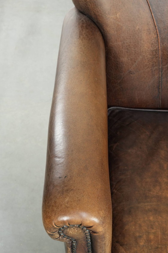 Image 1 of 2 fauteuils design en peau de mouton avec une belle patine