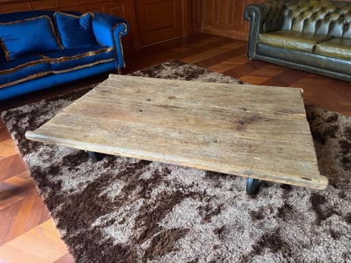 Unique industrial coffee table made of (monastery) wood on wheels