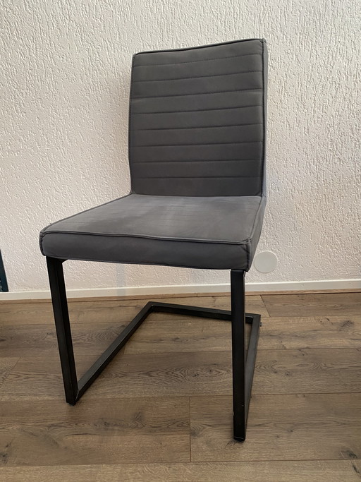 3 modern grey chairs