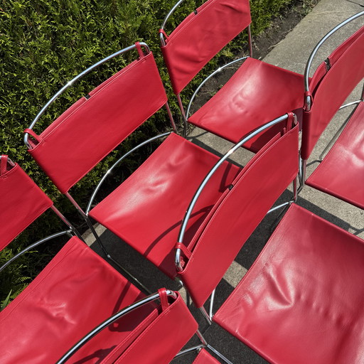 Red Delfina chairs by Enzo Mari