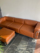 Leather three-seater sofa with ambassador