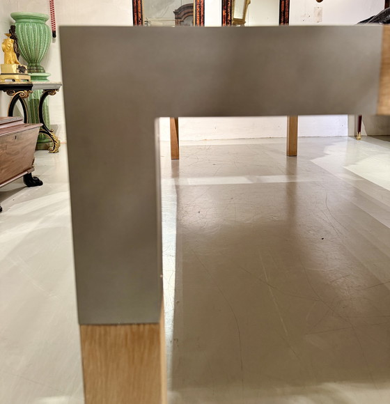Image 1 of A large oak dining table, designed by Claire Bataille and Paul Ibens