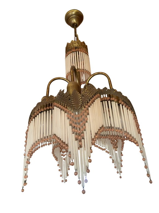 Vintage chandelier with glass rods and rose-colored beads
